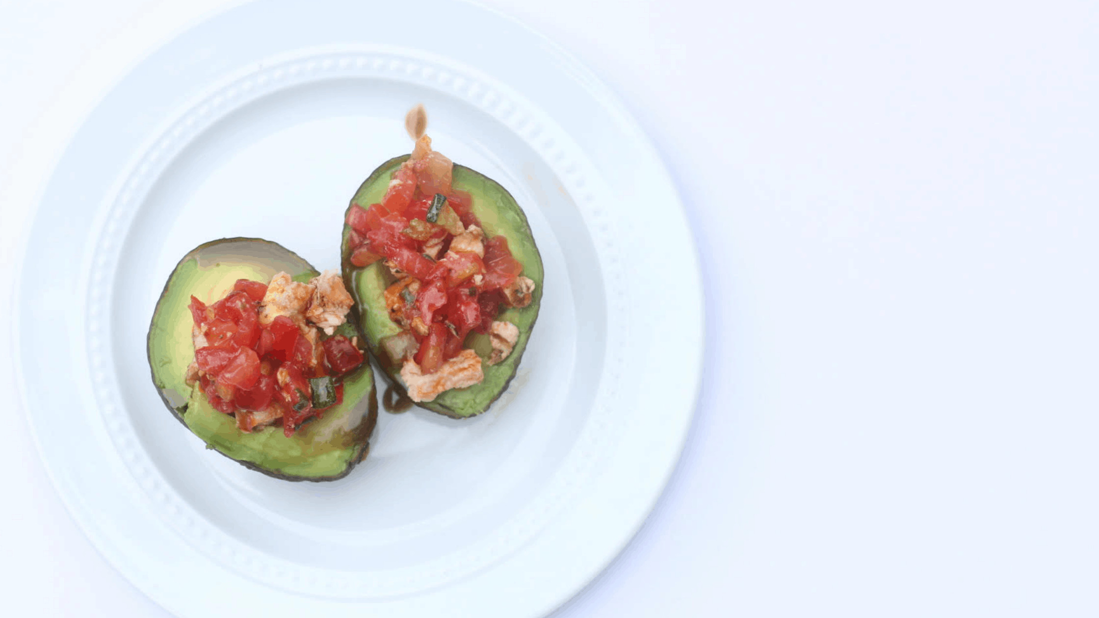 bruschetta stuffed avocado, cold lunch idea, paleo